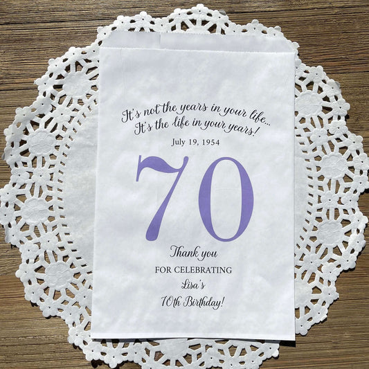Personalized 70th Birthday Favor Bags, fill them with sweet treats for your guests. White paper bags printed with a large # 70 and personalized for the guest of honor. Larger favor bags to hold more treats. Adult part favor bags that also great for holding a napkin and utensils.