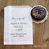 Our personalized glassine bridal shower favor bags are perfect for a candy bar, cookie bar, donut bar or brownies.  Each translucent bag comes printed with 'love is sweet enjoy a treat thank you for making my day complete.'  Personalized with the brides name and event date.  Bags are glassine and grease resistant.