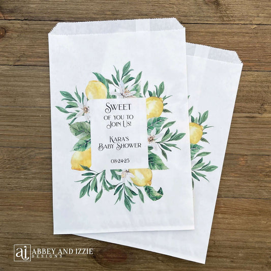 Lemon baby shower favor bags, personalized for the Mother to be. Printed on white bags and adorned with lemons and green leafs, perfect for a Italian lemon themed shower.