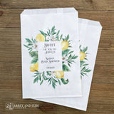 Lemon baby shower favor bags, personalized for the Mother to be.  Printed on white bags and adorned with lemons and green leafs, perfect for a Italian lemon themed shower.