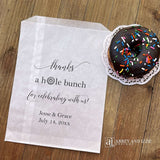 Our personalized wedding donut bags will add a special touch to your donut bar.  Each bag is printed 'thanks a hole bunch for celebrating with us!' with the bride and grooms name and wedding date.  Bags are glassine and grease resistant.  Also great for donut walls.