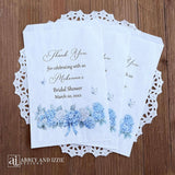 Personalized blue hydrangea bridal shower favors bags, perfect for a small gift of appreciation or a cookie bar or even a candy bar.  White bags adorned with delicate blue hydrangeas for a sweet addition to your event.