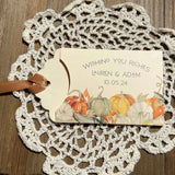 Ivory lottery ticket envelopes for a fall wedding, personalized for the bride and groom.  Each comes with moss green or gold ribbon attached, adorned with a fall scene.  Slide a lottery ticket in to see who wins.