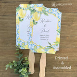 Our Amalfi Coast wedding fans personalized are printed on white stock adorned with lemons and blue tiles to match your Mediterranean Theme wedding.  Fans are personalized for the bride and groom, two sided with handle hidden between.  They come fully assembled and ready for your special day.