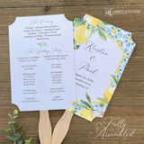 Mediterranean Wedding Program Fans, adorned with blue tiles and lemons. Printed on white card stock, two sided with handle hidden between. Wedding program on the back on the fans, front is personalized for the bride and groom.