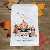 White paper bags, Personalized Halloween Candy Bags, adorned with cute witches these can be used for trick or treat bags or trunk or treat bags.  Also can personalized for a business promotion to hand out at Halloween
