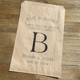 Monogrammed Wedding bags, printed with love is sweet thank you for making our day complete with your large initial in the center.  Personalized wedding favor bags are larger than most, perfect for a candy buffet, cookie buffet, popcorn or whatever you desire.