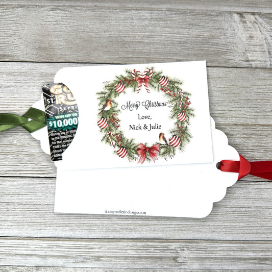 Personalized Christmas Party Favors Affordable Christmas Gifts, adorned with a beautiful wreath and a red or green ribbon attached. These can be used for lottery ticket favors or gift card holders.