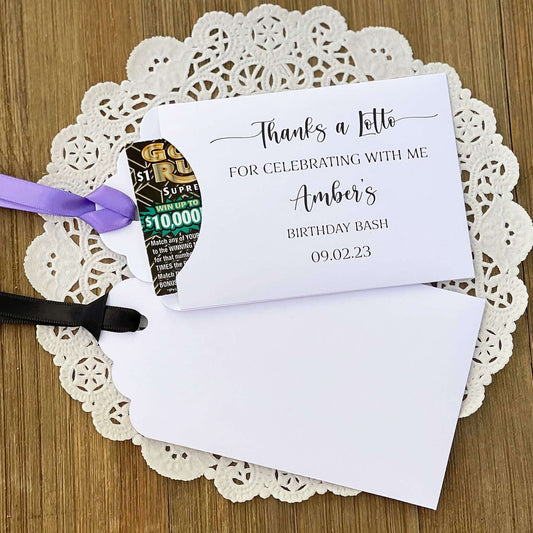 Thanks a Lotto Adult Birthday Favor, slide scratch off ticket in these cute envelopes for a fun party favor. Printed 'thanks a lotto for celebrating with me' with the guest of honros name and party date. Slide a lotto ticket in to see who wins. Printed on white card stock, your choice of ribbon color.
