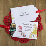 Small Christmas gift Lottery Ticket Envelopes featuring a snowman design and red ribbon, perfect for holiday gifting.