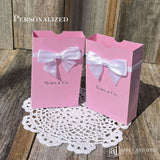 Personalized pink favor boxes with bow for the guest of honor.  Made from pink card stock with white ribbon and bow around the top which comes attached.