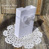 White favor boxes for any occasion personalized.  Made from white card stock with white ribbon around the box and a white satin bow attached.