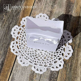 White favor boxes for any occasion personalized.  Made from white card stock with white ribbon around the box and a white satin bow attached.