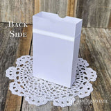 White favor boxes for any occasion personalized.  Made from white card stock with white ribbon around the box and a white satin bow attached.