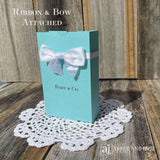 Tiffany & co. Personalized Favor Boxes for any Event.  Boxes feature white ribbon around the top adorned with a white box.  Great for candy or any sweet treat.