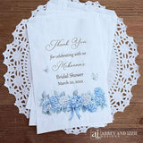 Personalized blue hydrangea bridal shower favors bags, perfect for a small gift of appreciation or a cookie bar or even a candy bar.  White bags adorned with delicate blue hydrangeas for a sweet addition to your event.