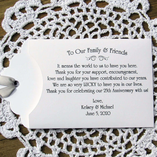 Lottery Ticket Envelopes for Wedding Anniversary Favors, these can be made for any anniversary year. Shown here for a 25th Anniversary with silver ribbon printed on white envelopes. Slide a scratch off lotto in to see which guests win big