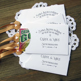 Our 50th wedding anniversary favors are personalized for the happy couple.  Still lucky in lover after 50 years printed on white envelopes with gold ribbon attached.  Slide a lottery ticket in the open end for a fun favor guest will love.