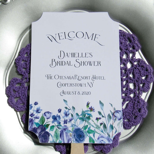 Lavender Bridal Shower Fans, personalized for the bride to be. Printed on white card stock with wooden handle hidden between, adorned with lavender flowers.