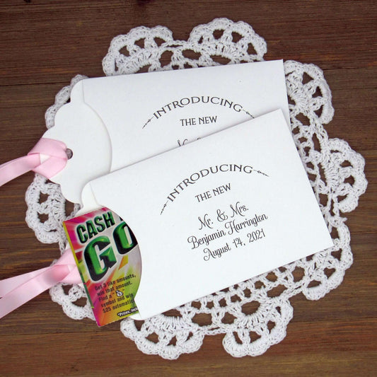 Lottery Ticket Wedding Guest Favors personalized for the bride and groom. Printed with 'introducing the new Mr. & Mrs. followed by your personal information. Slide a lottery ticket in these for a fun favor. Your choice of envelope and ribbon color.