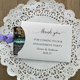 Personalized engagement party favors, envelopes for a lotto ticket  party favor.  Your choice of envelope color and ribbon color to match your party theme.  Celebrate your engagement in style with these unique engagement party favors.
