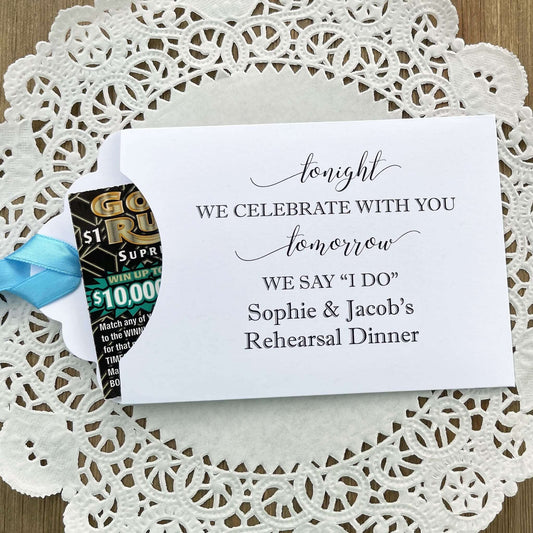 Fun rehearsal dinner favors, slide a lottery ticket in each one and see which guest wins. Personalized favors for the bride and groom with choice of envelope and ribbon color.