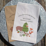Wildlife Baby Shower favor Bags, personalized for the new baby.  Adorned with wildlife animals and printed with 'our adventure begins'.