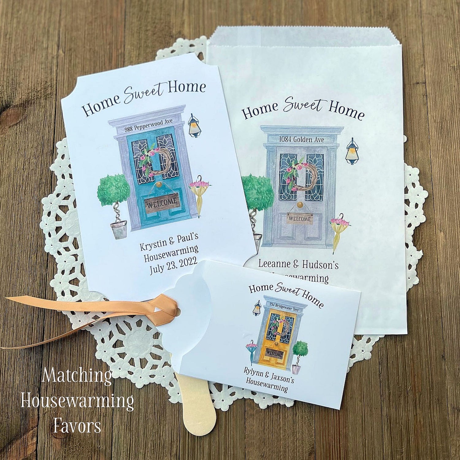 Personalized housewarming party favors, we offer fans, favor bags and the ever popular lottery ticket holders.  Each adorned with a inviting front door and personalized for the new home owners.