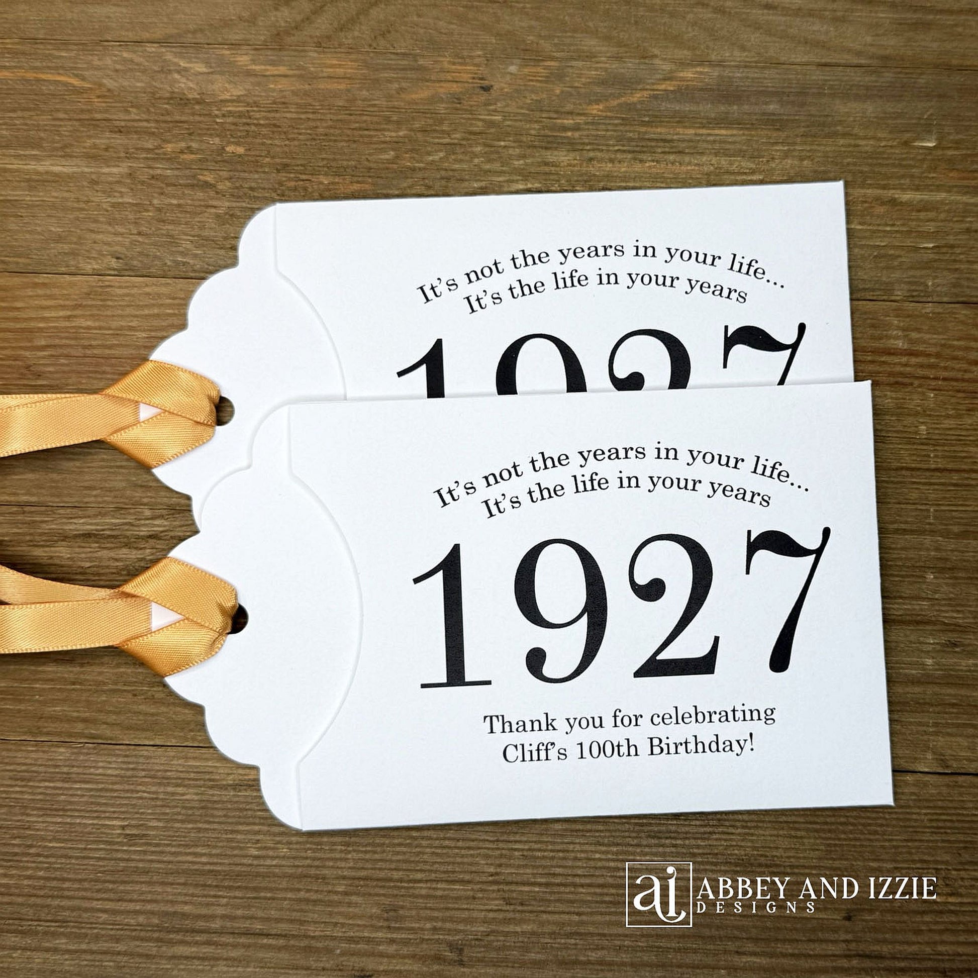 Our 100th birthday party favors are personalized for the guest of honor, your choice of ribbon color and year color. Always a fun ice breaker, slide a scratch off ticket in and see who is the winner! Each 100th birthday favor comes with the year the honoree was born printed in the center with 'It's not the years in your life...it's the life in your years' and happy birthday to the guest of honor. These can be made for any birthday year, 50th, 60th, 70th, 100th your choice. 100th Birthday Party Favors