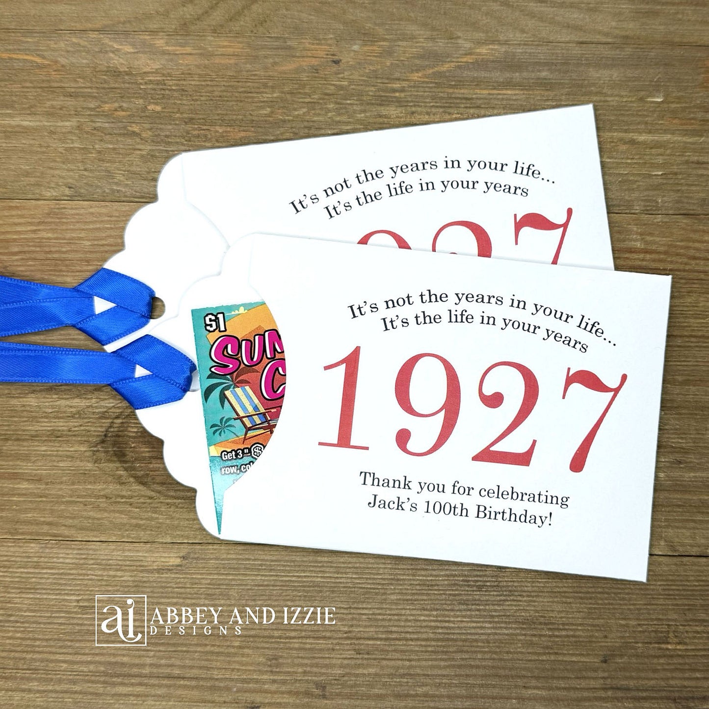 Our 100th birthday party favors are personalized for the guest of honor, your choice of ribbon color and year color. Always a fun ice breaker, slide a scratch off ticket in and see who is the winner! Each 100th birthday favor comes with the year the honoree was born printed in the center with 'It's not the years in your life...it's the life in your years' and happy birthday to the guest of honor. These can be made for any birthday year, 50th, 60th, 70th, 100th your choice. 100th Birthday Party Favors