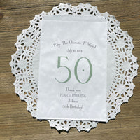 White bags printed with a large 50 in color, guest of honor birth date and name thanking your guests for celebrating with you.  Large bags can hold sweet treats, popcorn, pretzels or use for napkin and utensils. 