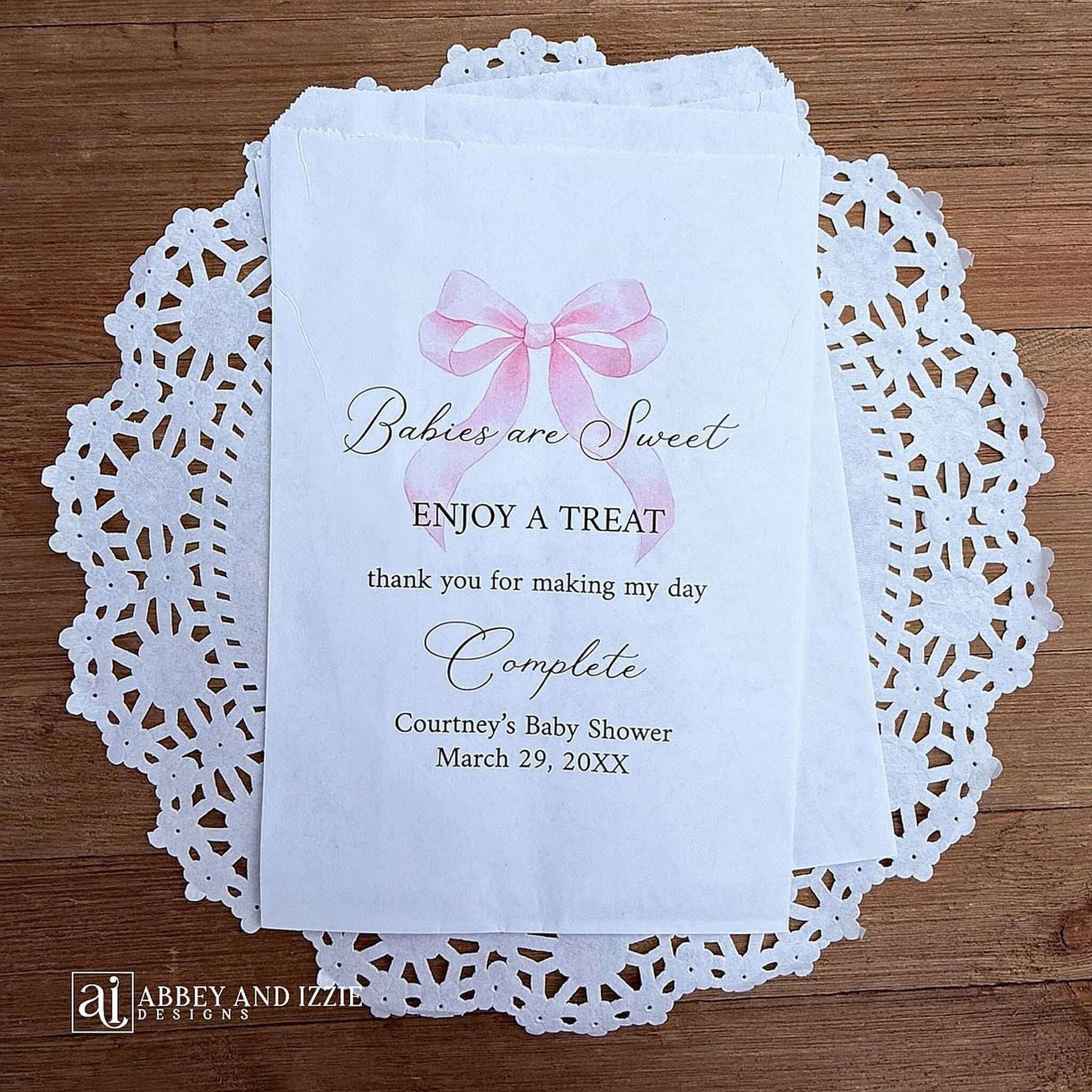 Babies are sweet enjoy a treat thank you for making my day complete. Adorned with a pink bow and personalized for the mother to be these bags are perfect for a candy bar or any sweet treat for your guests.