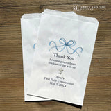 Celebrate your son's First Communion with our personalized First Communion Favor Bags that transform a sacred moment into a cherished memory. Each bag is customized with his name, event date and a sweet thank you.  Printed on white bags with a fun blue bow and a cross.