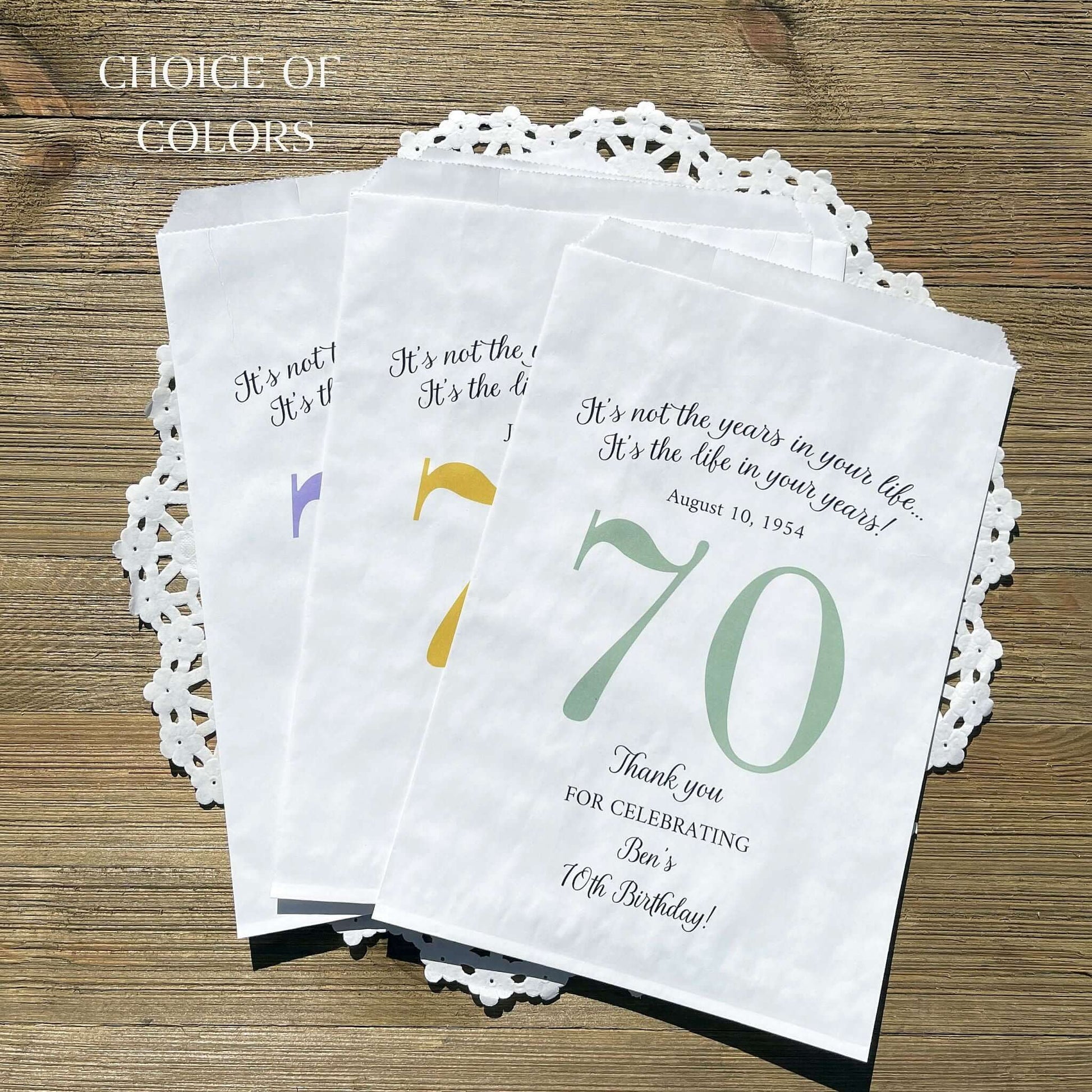 Personalized 70th Birthday Favor Bags, fill them with sweet treats for your guests.  White paper bags printed with a large # 70 and personalized for the guest of honor.  Larger favor bags to hold more treats.  Adult part favor bags that also great for holding a napkin and utensils.