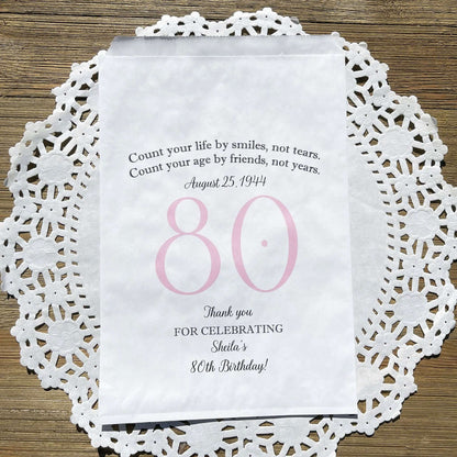 These 80th Birthday Favor Bags, personalized for the guest of honor for an 80th birthday party.  Printed on white bags your choice of large number color.  Larger than most favor bags these are perfect for many sweet treats for your party guests.  A fun bag for an 80th birthday celebration.