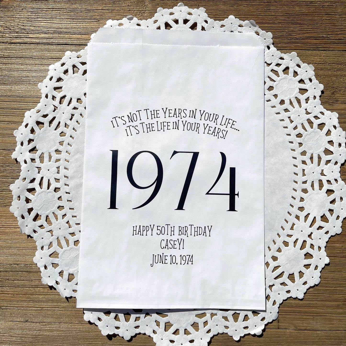 Adult birthday favor bags personalized,  white bags with the year the guest of honor was born printed with their birth date.  Your choice of colors, adorned with a sweet message.  