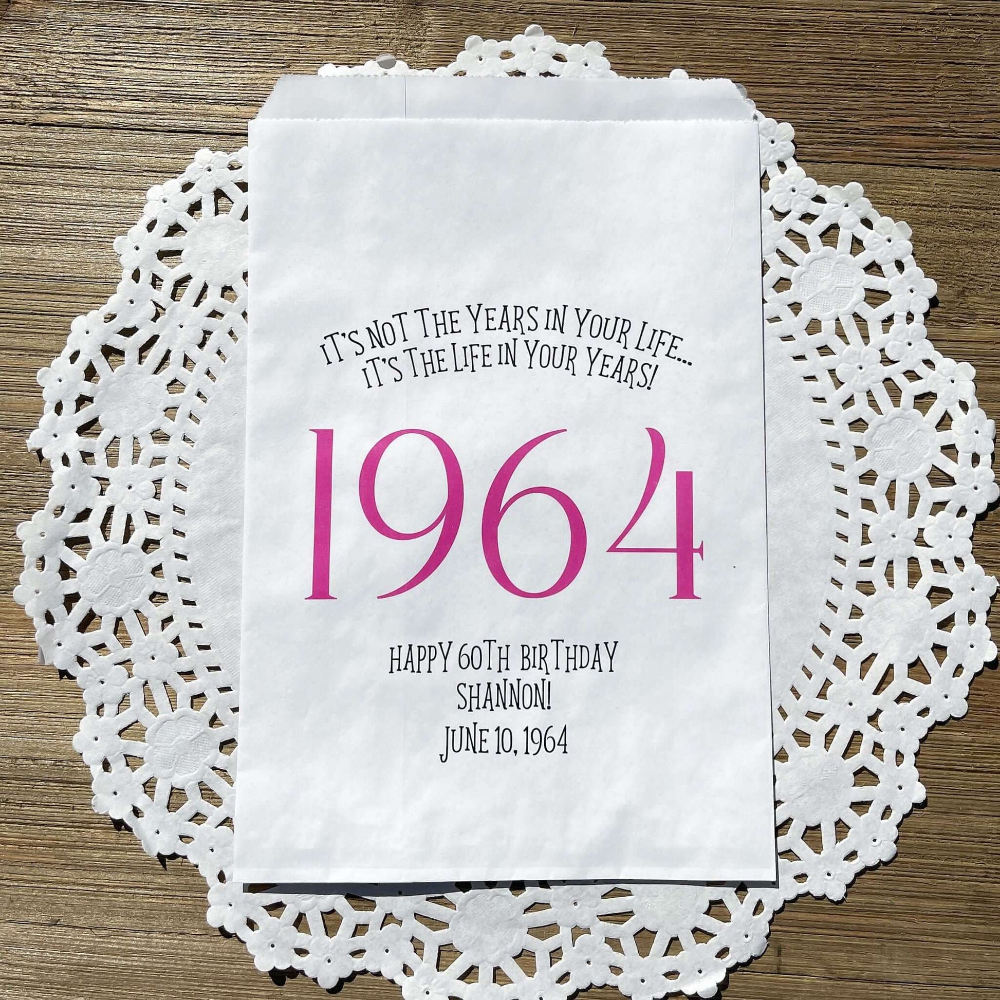 Adult birthday favor bags personalized,  white bags with the year the guest of honor was born printed with their birth date.  Your choice of colors, adorned with a sweet message.  