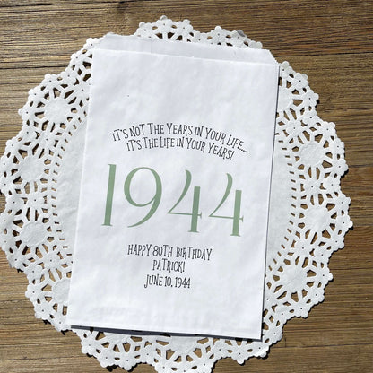 Adult birthday favor bags personalized,  white bags with the year the guest of honor was born printed with their birth date.  Your choice of colors, adorned with a sweet message.  