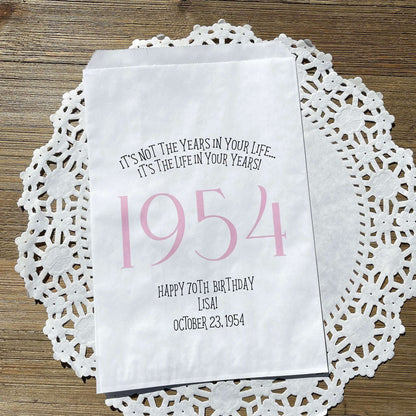 Adult favor bags for any birthday year. White bags with the year the guest of honor was born printed with their birth date. Your choice of colors, adorned with a sweet message.