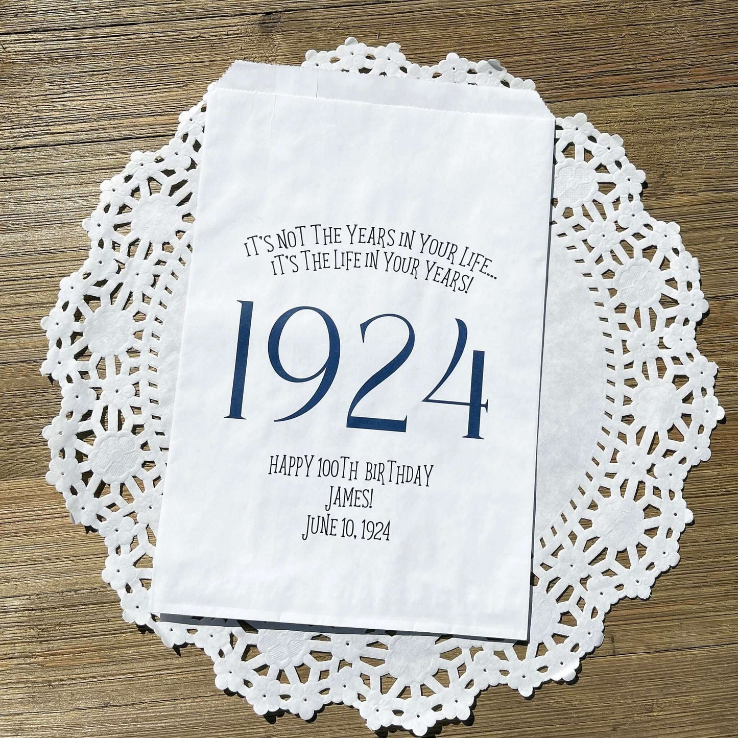 Adult birthday favor bags personalized,  white bags with the year the guest of honor was born printed with their birth date.  Your choice of colors, adorned with a sweet message.  