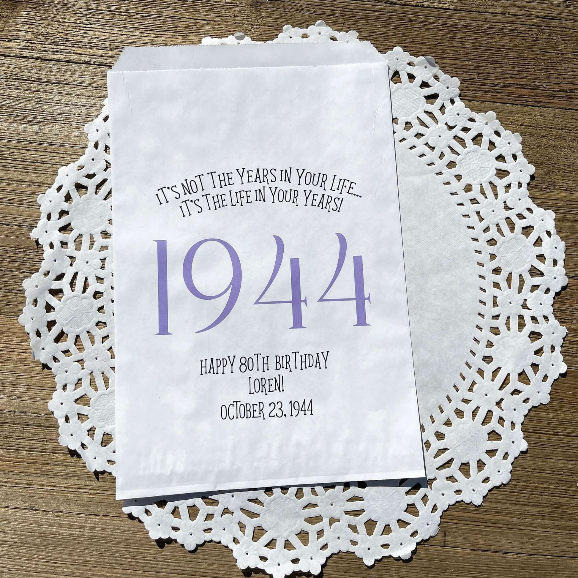 Adult birthday favor bags personalized,  white bags with the year the guest of honor was born printed with their birth date.  Your choice of colors, adorned with a sweet message.  