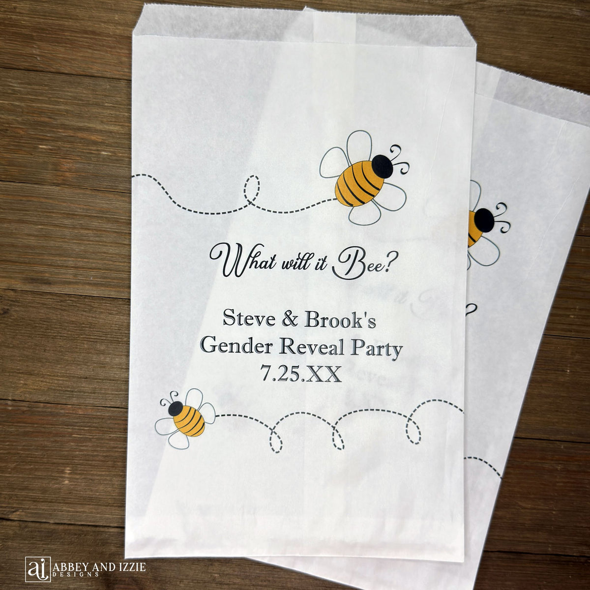 What will it Bee gender reveal party bags, printed on white bags, adorned with cute bumble bees.  Personalized with the parents to be names and event date.  Perfect for sweet treats or fun take home thank you gifts.