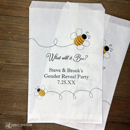 What will it Bee gender reveal party bags, printed on white bags, adorned with cute bumble bees.  Personalized with the parents to be names and event date.  Perfect for sweet treats or fun take home thank you gifts.