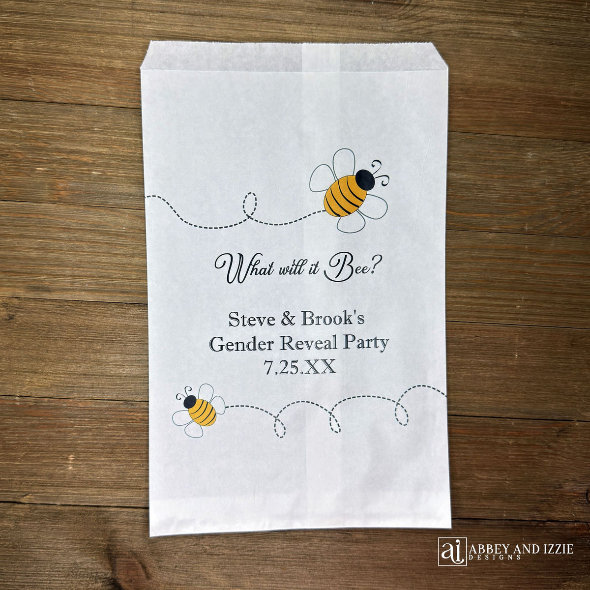 What will it Bee gender reveal party bags, printed on white bags, adorned with cute bumble bees.  Personalized with the parents to be names and event date.  Perfect for sweet treats or fun take home thank you gifts.