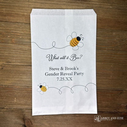 What will it Bee gender reveal party bags, printed on white bags, adorned with cute bumble bees.  Personalized with the parents to be names and event date.  Perfect for sweet treats or fun take home thank you gifts.