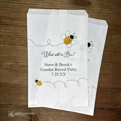 What will it Bee gender reveal party bags, printed on white bags, adorned with cute bumble bees.  Personalized with the parents to be names and event date.  Perfect for sweet treats or fun take home thank you gifts.