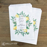 Lemon baby shower favor bags, personalized for the Mother to be.  Printed on white bags and adorned with lemons and green leafs, perfect for a Italian lemon themed shower.