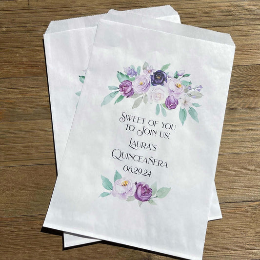 Purple Personalized Quinceanera Favor Bags, perfect for cookies,  sweet treats or candy buffet bags.  Bags are white with purple flowers printed for an elegant touch.  Personalized for the guest of honor.