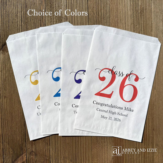 Graduation favor bags for the Class of 2026, perfect size for candy, popcorn, cookies or eating utensils.  White bags personalized for the graduate with class of 26, school name and date.