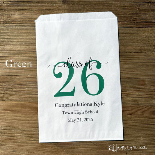 Graduation favor bags for the Class of 2026, perfect size for candy, popcorn, cookies or eating utensils.  White bags personalized for the graduate with class of 26, school name and date.
